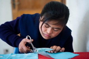 girl cutting cloth