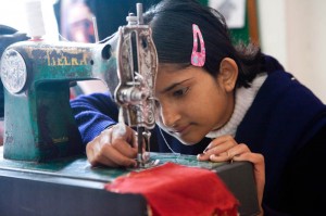 Girl using a sewing machine